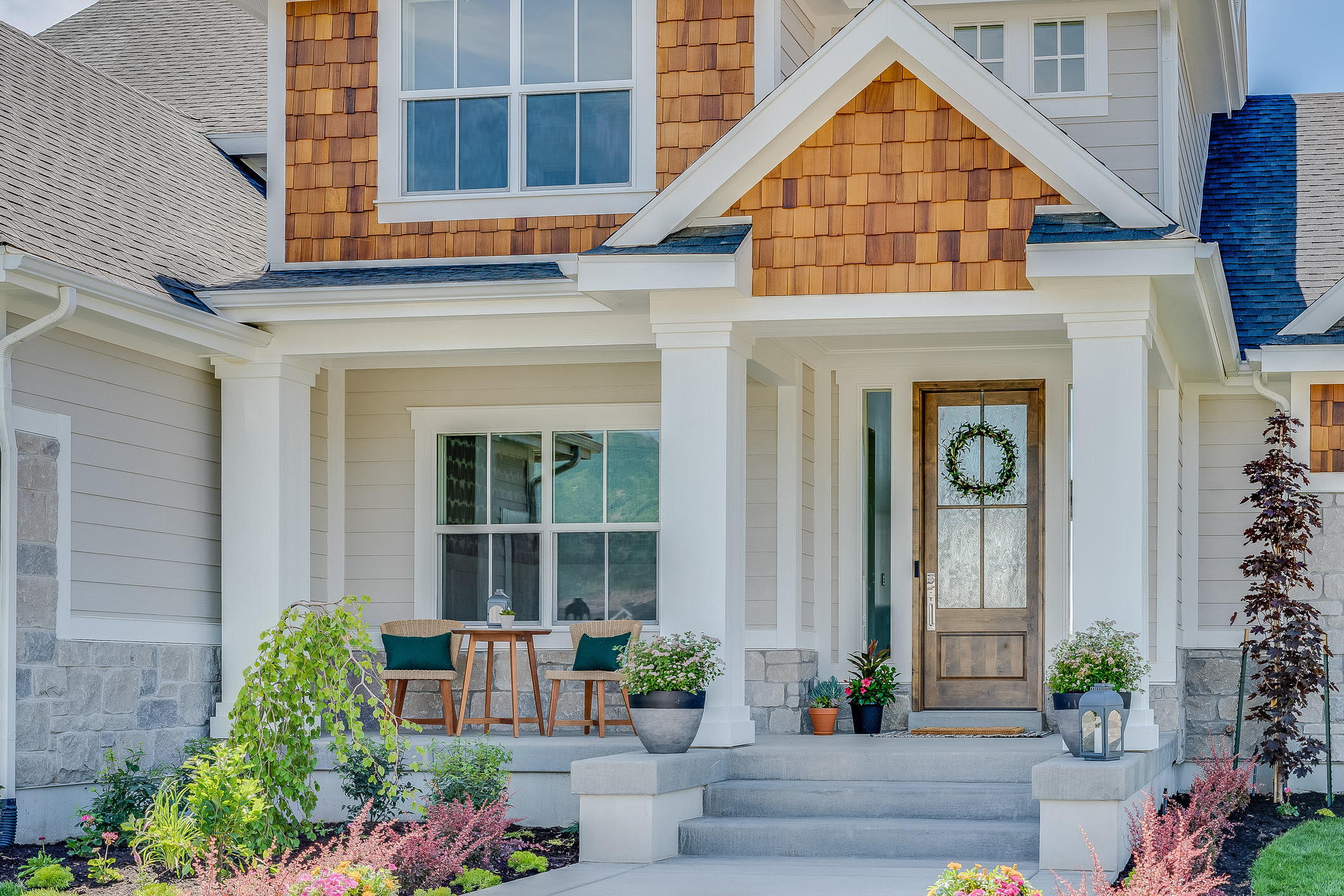 Traditional home with natural wood, siding and stone exterior