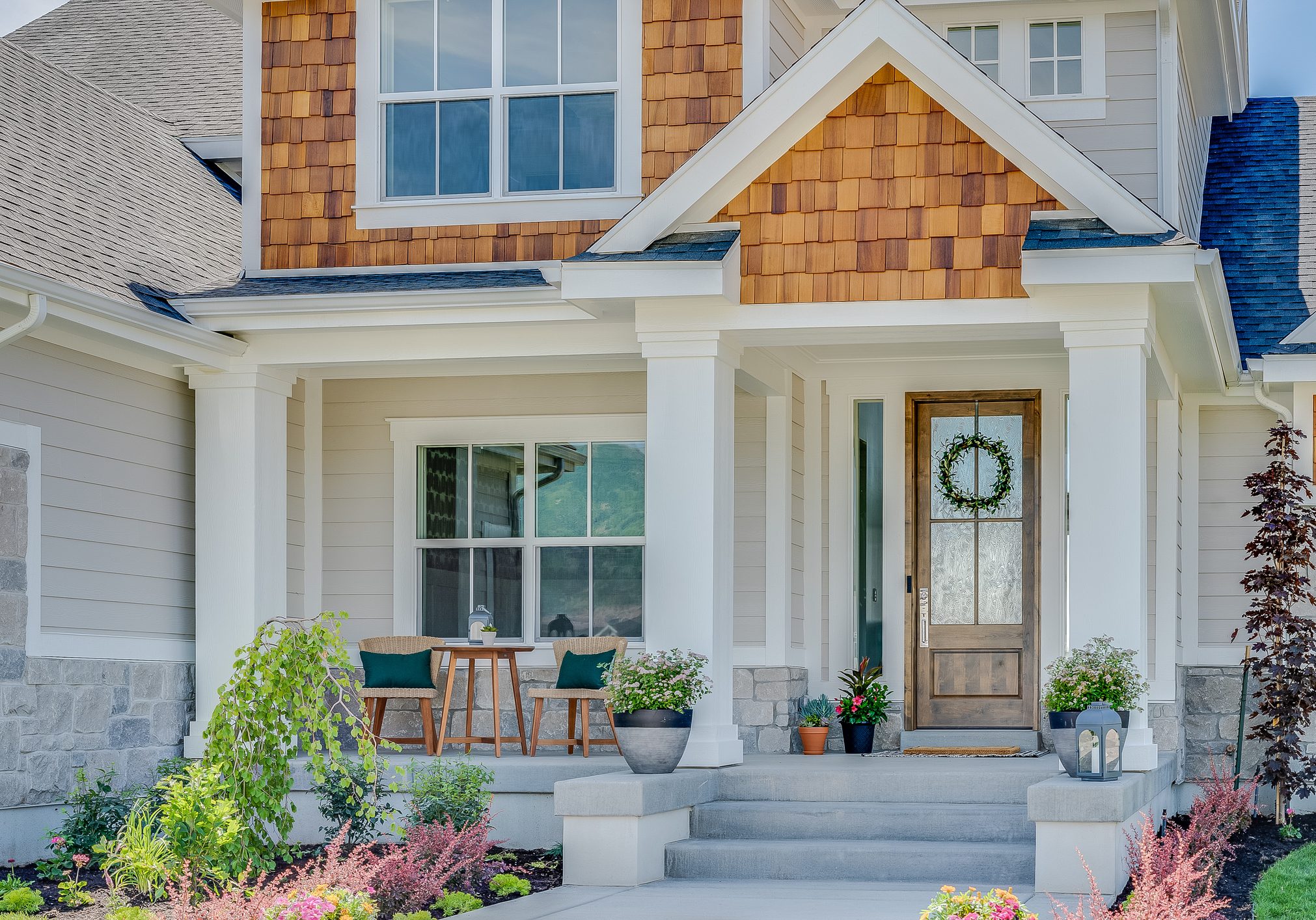 Traditional home with natural wood, siding and stone exterior